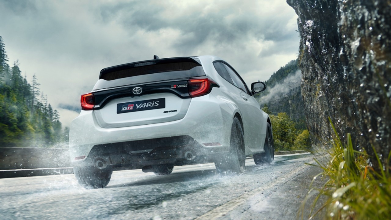 toyota-gr-yaris-driving-rain-back-1920x1080-1